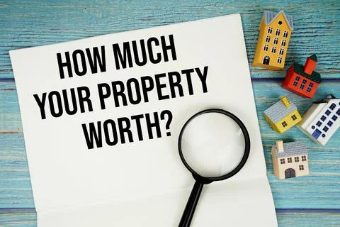 Notepad with "How Much Your Property Worth?" with magnifying glass and hous.. Stock Photos