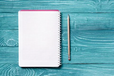 Notepad on light blue wooden background Stock Photos