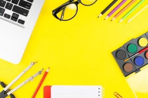 Notepad, multicolor pencils, divider, black glasses, colorful clips, oil colo Stock Photos
