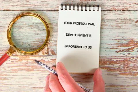 Notepad with a note highlighting the importance of professional development s Stock Photos
