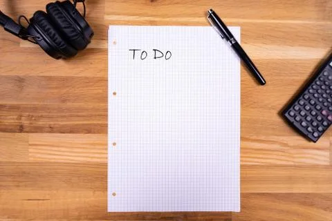A notepad with a note saying "To Do" together with a pen, a calculator and he Stock Photos