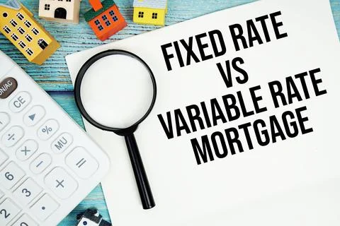 Notepad with "Notepad with "Fixed Rate Vs Variable Rate Mortgage" with Calc.. Fotos de archivo