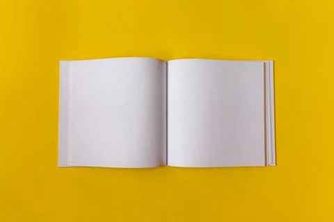 Notepad for notes with empty space for text. Yellow background. Stock Photos