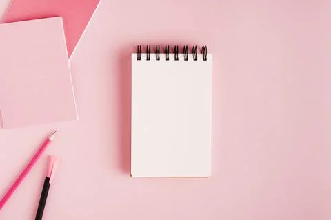 Notepad office supplies colored surface . High quality and resolution beautiful Stock Photos