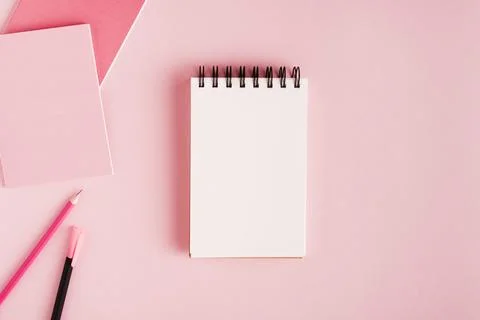 Notepad office supplies colored surface Stock Photos