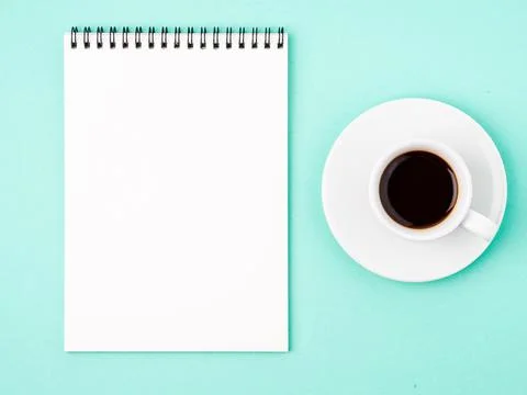 Notepad open with white blank page for writing idea or to-do list, a Cup of Stock Photos