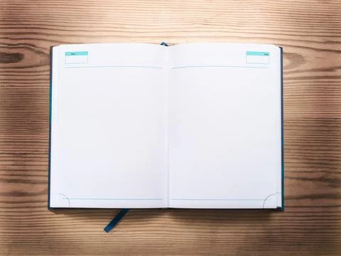 Notepad opened on wooden background top view flat lay Stock Photos