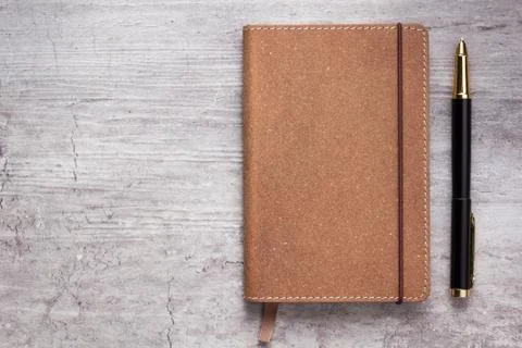 Notepad or notebook paper at stone background Stock Photos