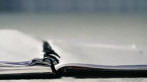 Notepad paper blowing in office Stock Footage 314257954