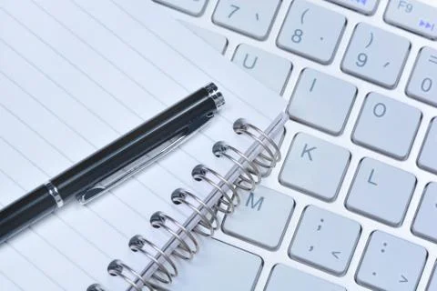 Notepad with pen and keyboard computer Stock Photos
