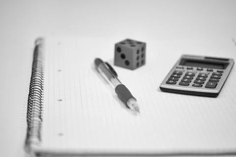 Notepad, Pen, Calculator and Dice (Black and White) Stock Photos