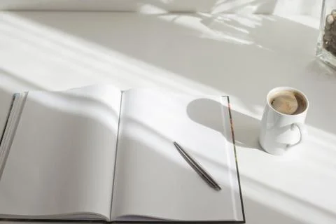 Notepad, pen, coffe  on white table Stock Photos