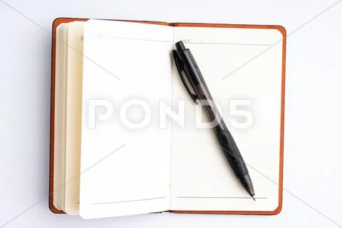 Notepad with pen isolated Stock Photos