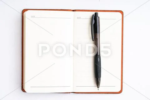 Notepad with pen isolated Stock Photos