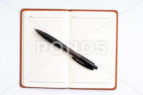 Notepad with pen isolated Stock Photos