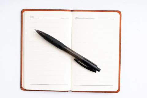 Notepad with pen isolated Stock Photos
