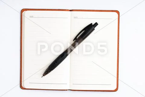 Notepad with pen isolated Stock Photos