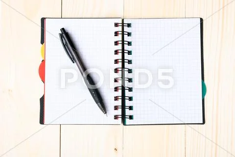 Notepad with pen isolated Stock Photos