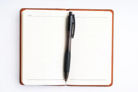 Notepad with pen isolated Stock Photos