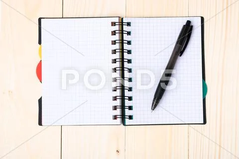 Notepad with pen isolated Stock Photos
