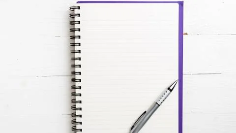 Notepad with pen Stock Photos