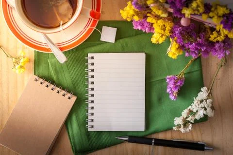 Notepad with pen on wood table Stock Photos