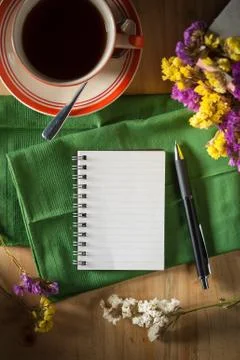 Notepad with pen on wood table Stock Photos