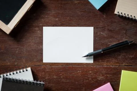 Notepad with pen on wood table Stock Photos