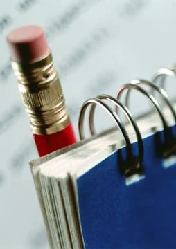 Notepad with pencil, close-up Stock Photos