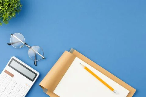 Notepad with pencil, glasses, note sheet and plant Stock Photos