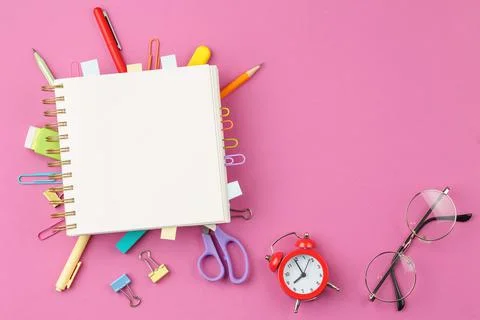 Notepad with pencil on pink background. Stock-Fotos