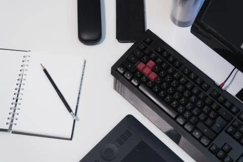 Notepad with a pencil on a white table Stock Photos