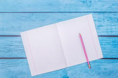 Notepad with pencil on wood board background.using wallpaper for education, b Stock Photos