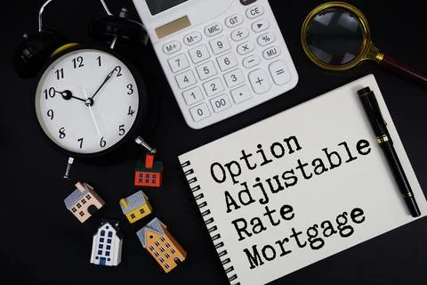 Notepad with the phrase "Option Adjustable Rate Mortgage" surrounded by a p.. Stock Photos