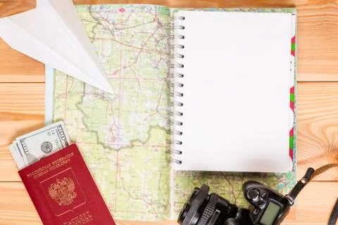 A notepad to record an expedition plan and a close-up map of the top view Stock Photos