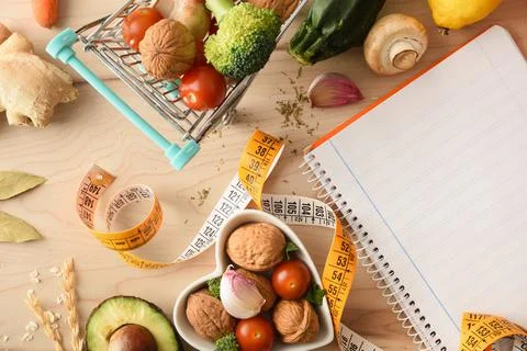 Notepad to score shopping list to prepare balanced food menus Stock Photos