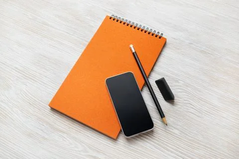 Notepad, smartphone, pencil, eraser Stock Photos