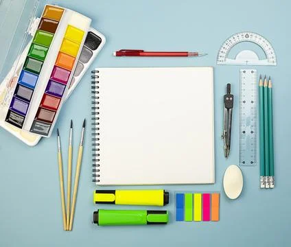 Notepad on a spring with white sheets and stationery school items. Stock Photos