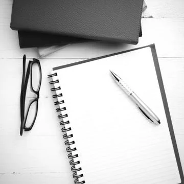 Notepad with stack of book black and white tone color style Stock Photos