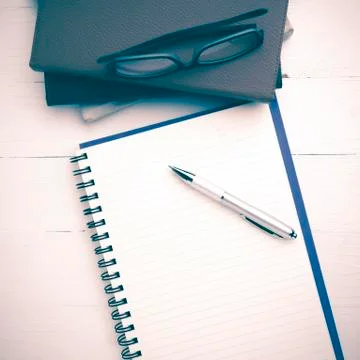 Notepad with stack of book vintage style Stock Photos