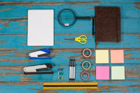 Notepad, stapler, pins, sellotapes, diary, sticky notes, ruler and pens Stock Photos
