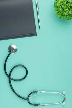 Notepad with stethoscope on the table. Stock Photos
