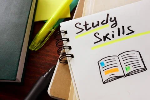 Notepad with study skills on the table. Stock Photos