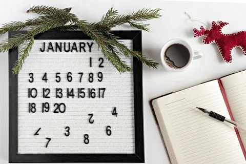Notepad for taking notes of goals and plans for the new year, calendar,a cup  Stock Photos