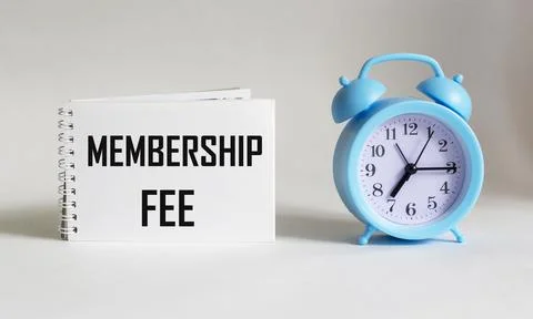 On notepad text about membership fee, business concept image on white backgro Stock Photos