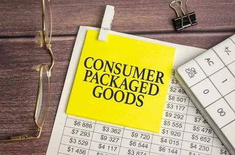 A notepad with the text CPG - Consumer Packaged Goods pen, reports, Stock Photos