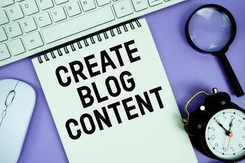 Notepad with the text "Create Blog Content" and white keyboard, wireless mo.. Stock Photos