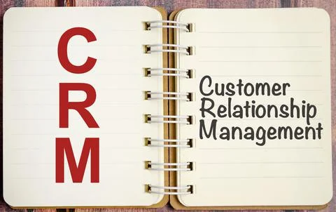 Notepad with the text CRM Customer Relationship Management Stock Photos