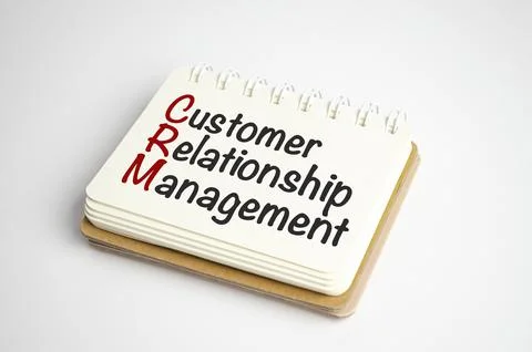 Notepad with the text CRM Customer Relationship Management Stock Photos
