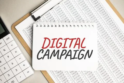 Notepad with text DIGITAL CAMPAIGN , with black marker on white background Stock Photos